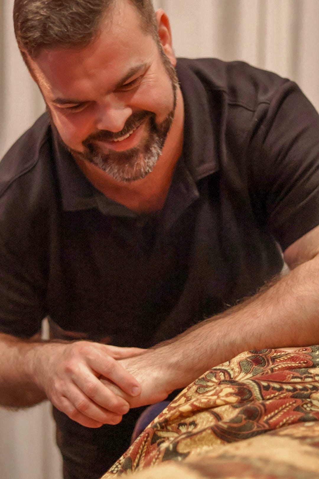 Mathew working on a client's foot during a session